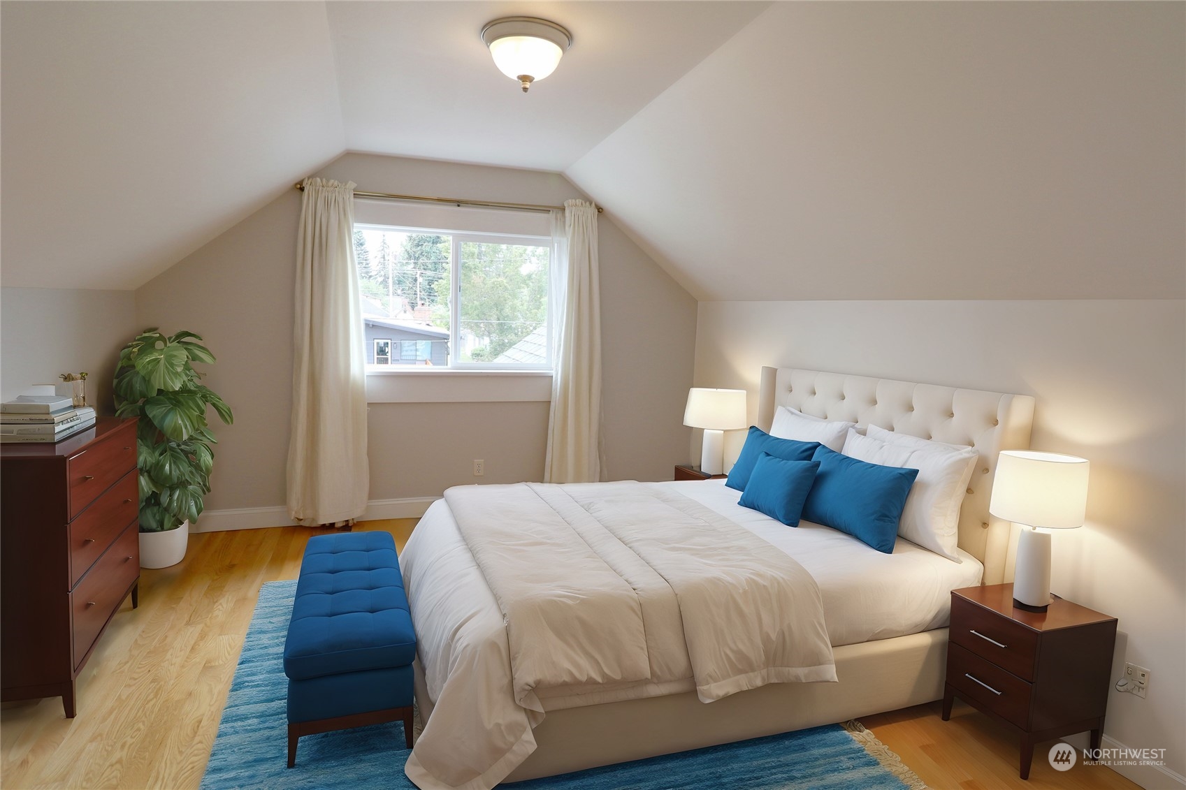 1908 4th Street Bremerton, WA 98337 - Photo 20 of 34 a bedroom with a bed and wooden floor