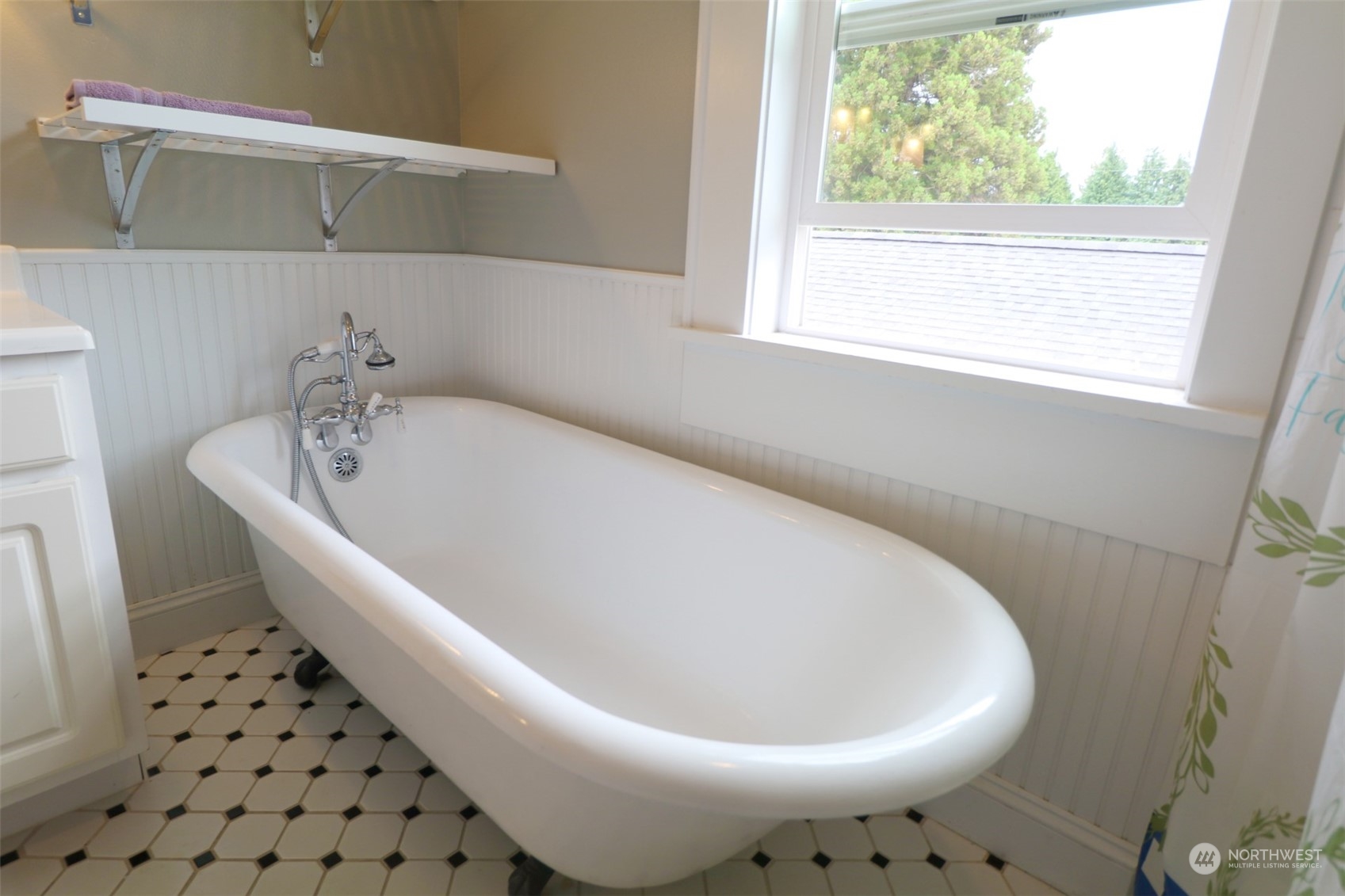 1908 4th Street Bremerton, WA 98337 - Photo 22 of 34 a white bath tub sitting in a bathroom