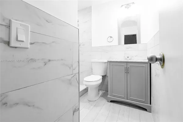 a swimming pool with outdoor seating and a garden