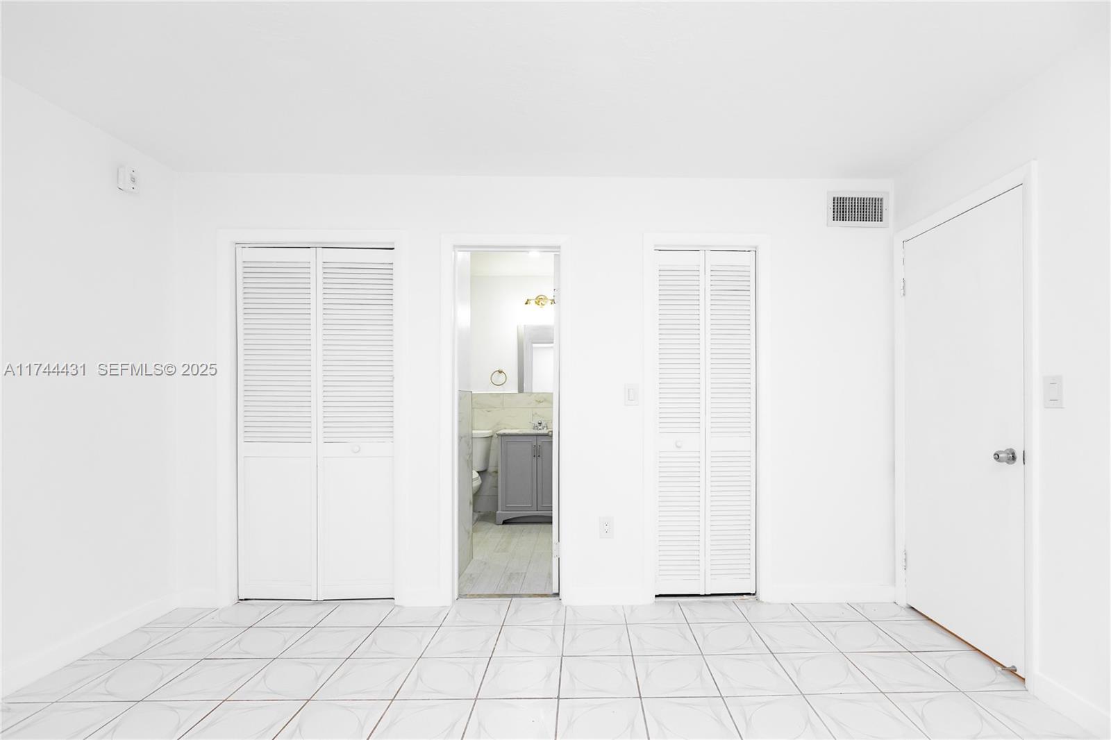 1060 Northeast 78th Street, Unit 5 Miami, FL 33138 - Photo 9 of 17 a view of an empty room