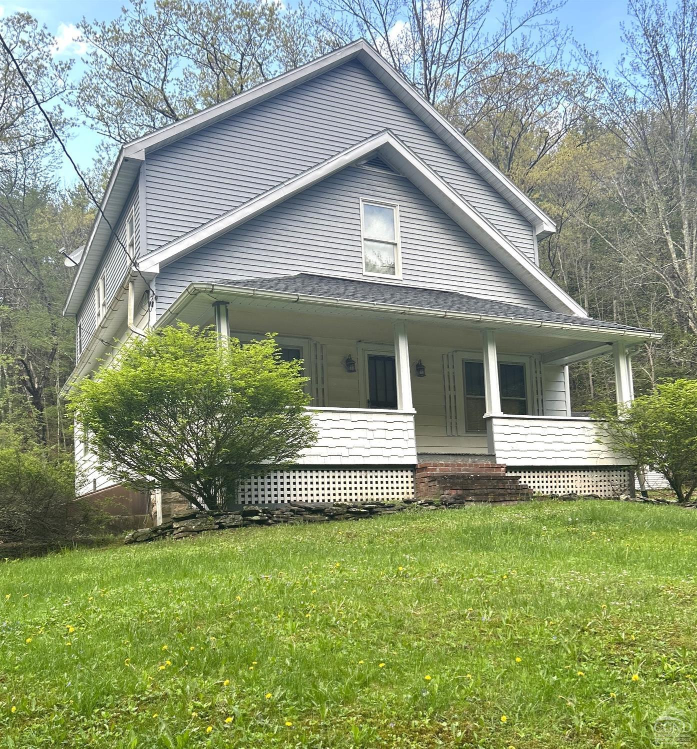 169 Rt 4 Prattsville, NY 12468 - Photo 3 of 43 a front view of a house with a garden