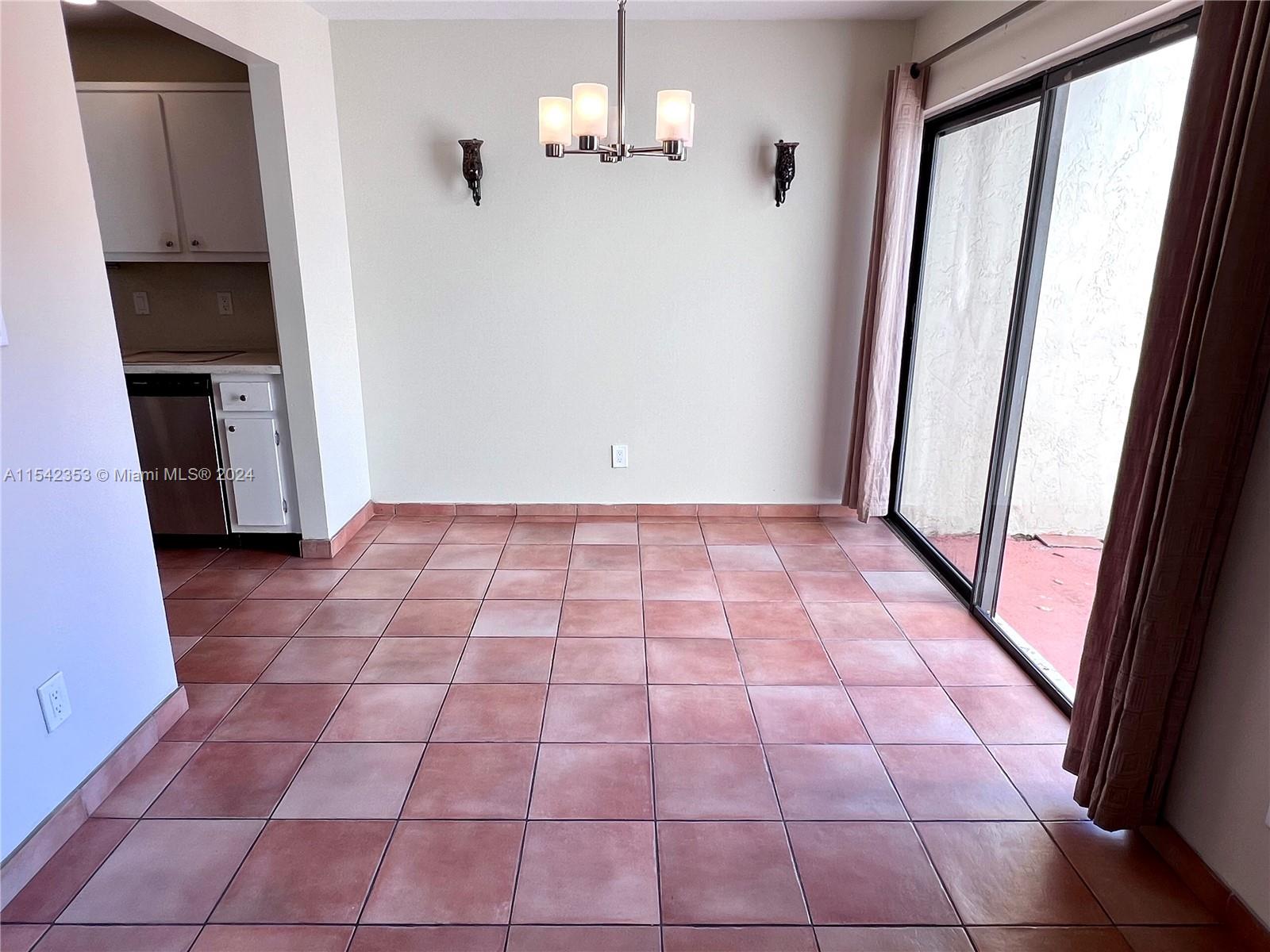 11353 Southwest 109th Road, Unit 55Z Miami, FL 33176 - Photo 18 of 82 a view of empty room with wooden floor and fan