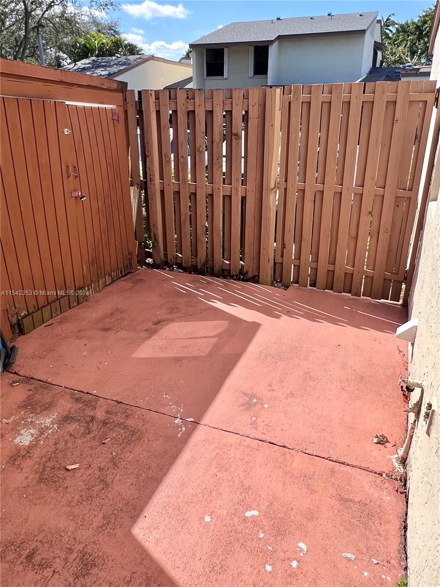 11353 Southwest 109th Road, Unit 55Z Miami, FL 33176 - Photo 24 of 82 a view of outdoor space with wooden fence