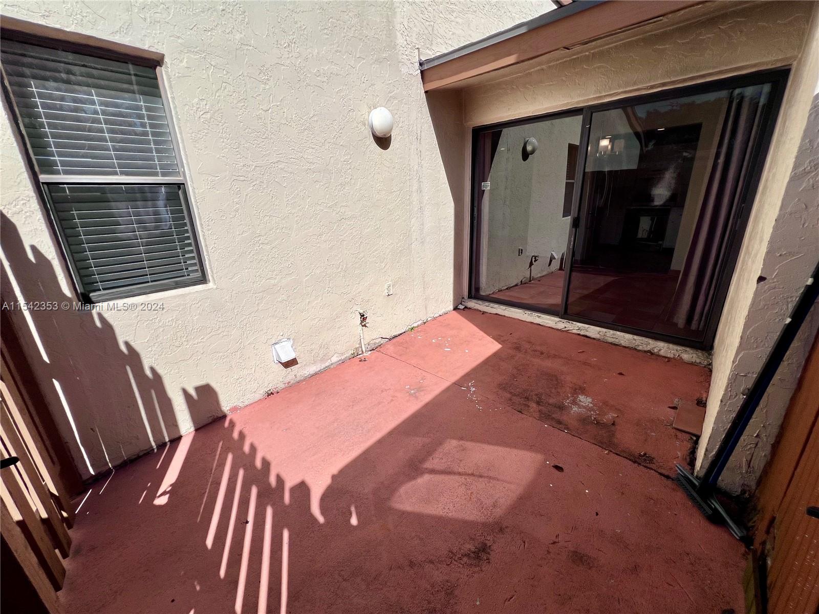 11353 Southwest 109th Road, Unit 55Z Miami, FL 33176 - Photo 25 of 82 a bedroom with a bed and a window