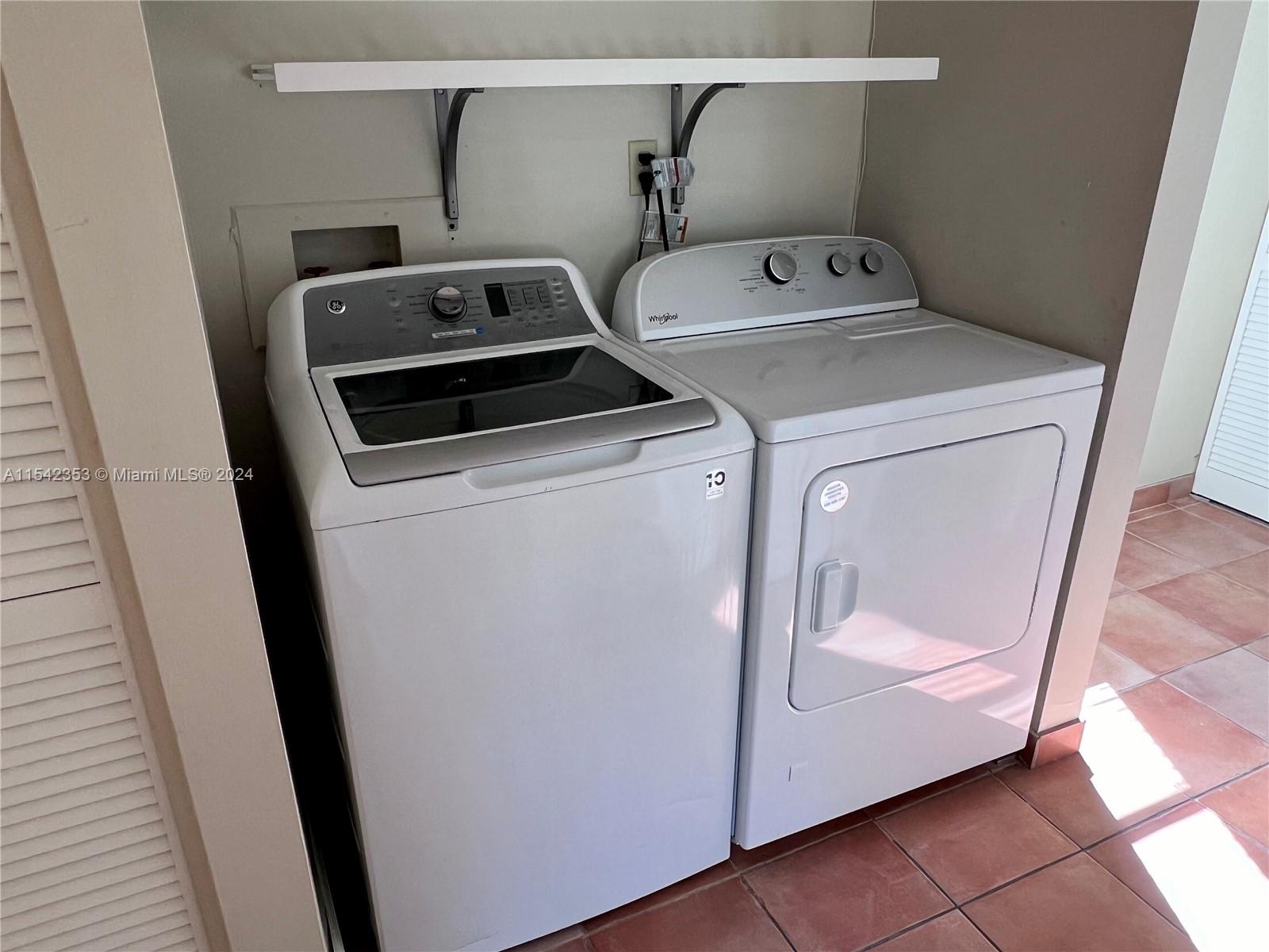 11353 Southwest 109th Road, Unit 55Z Miami, FL 33176 - Photo 27 of 82 a utility room with dryer and washer