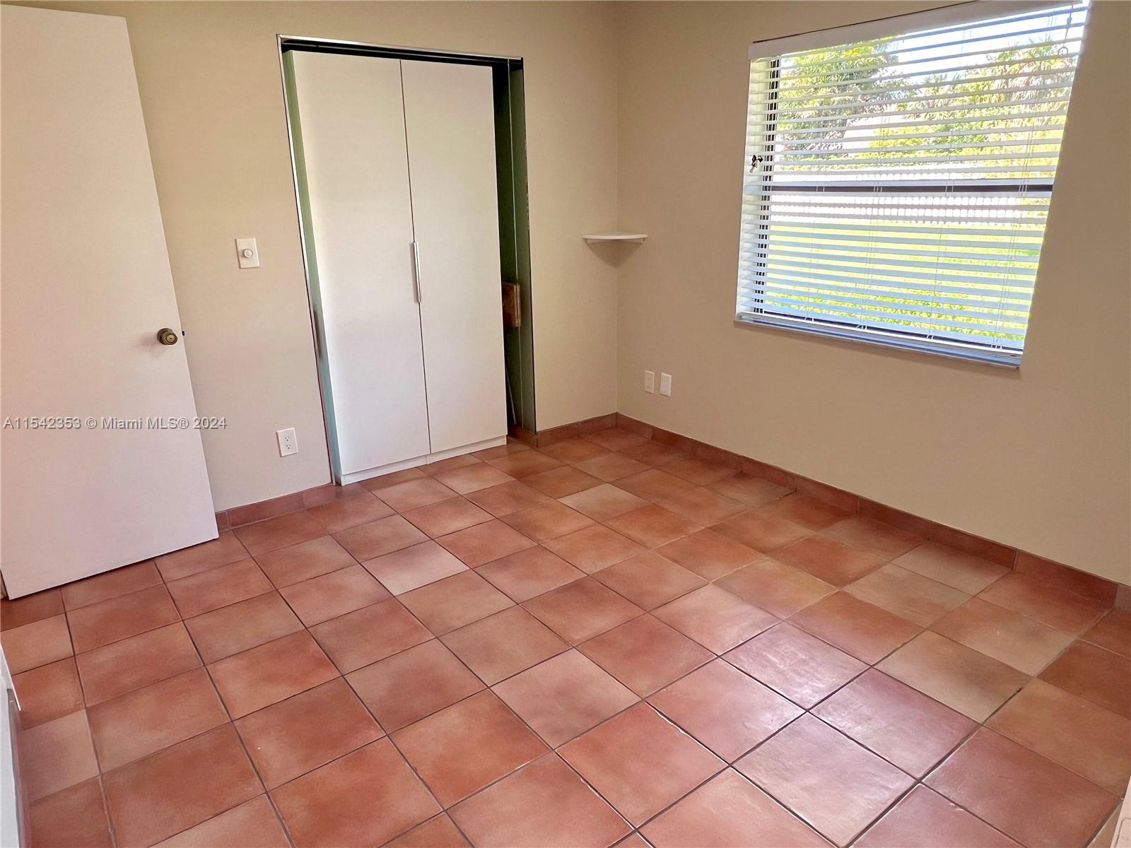11353 Southwest 109th Road, Unit 55Z Miami, FL 33176 - Photo 29 of 82 a view of an empty room with a window