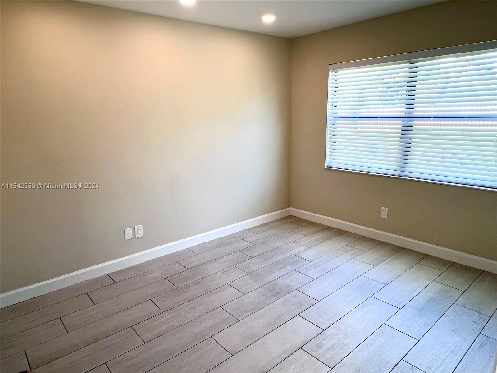 11353 Southwest 109th Road, Unit 55Z Miami, FL 33176 - Photo 33 of 82 a view of an empty room with a window
