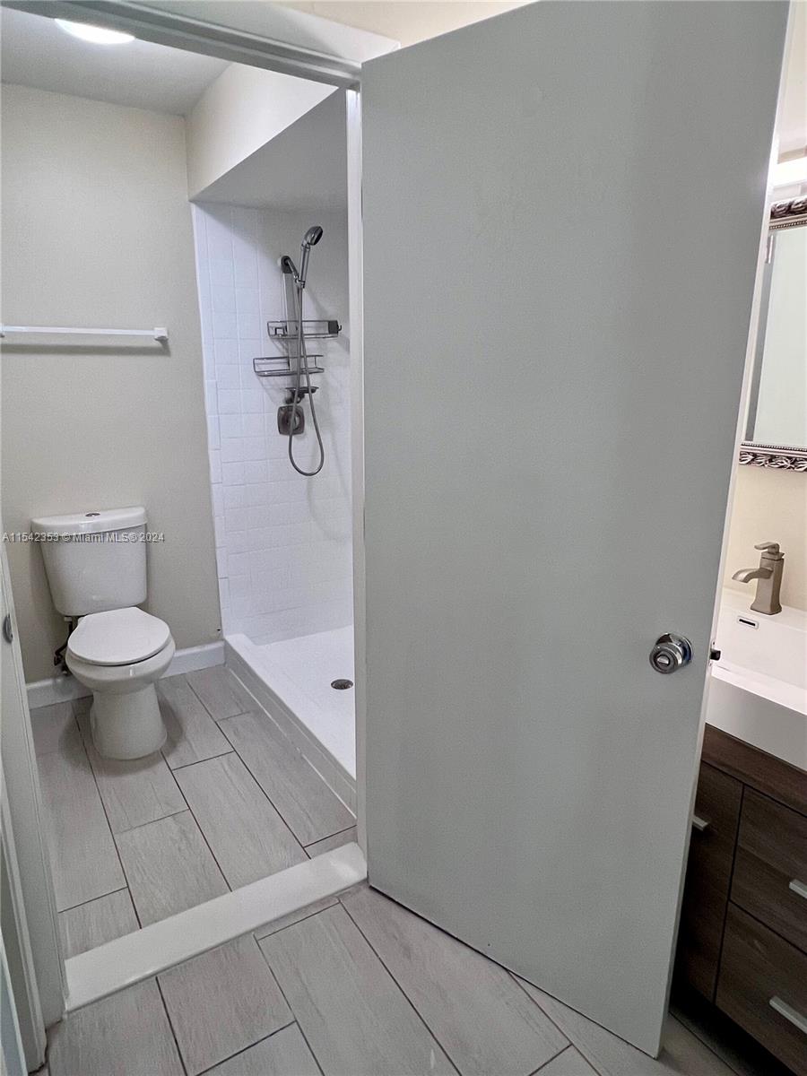 11353 Southwest 109th Road, Unit 55Z Miami, FL 33176 - Photo 45 of 82 a bathroom with a toilet and a sink