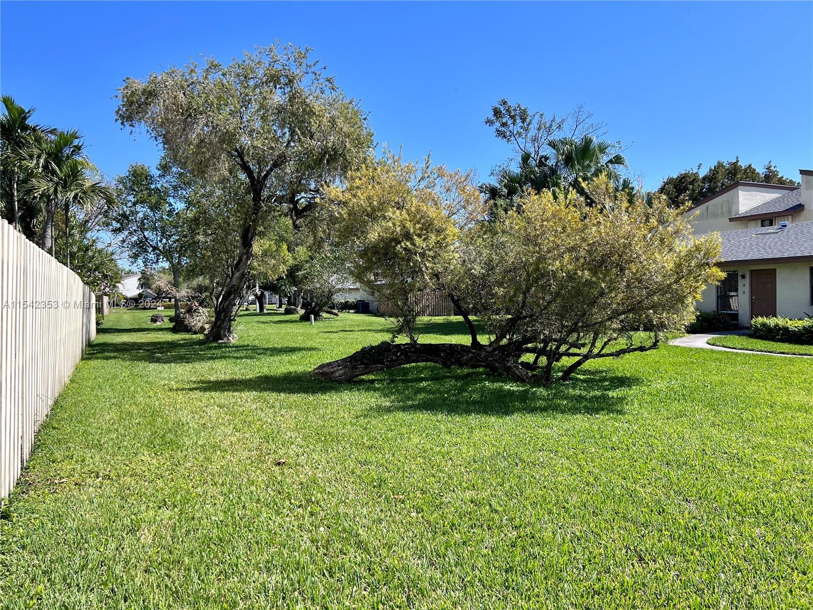11353 Southwest 109th Road, Unit 55Z Miami, FL 33176 - Photo 53 of 82 a view of a park with large trees