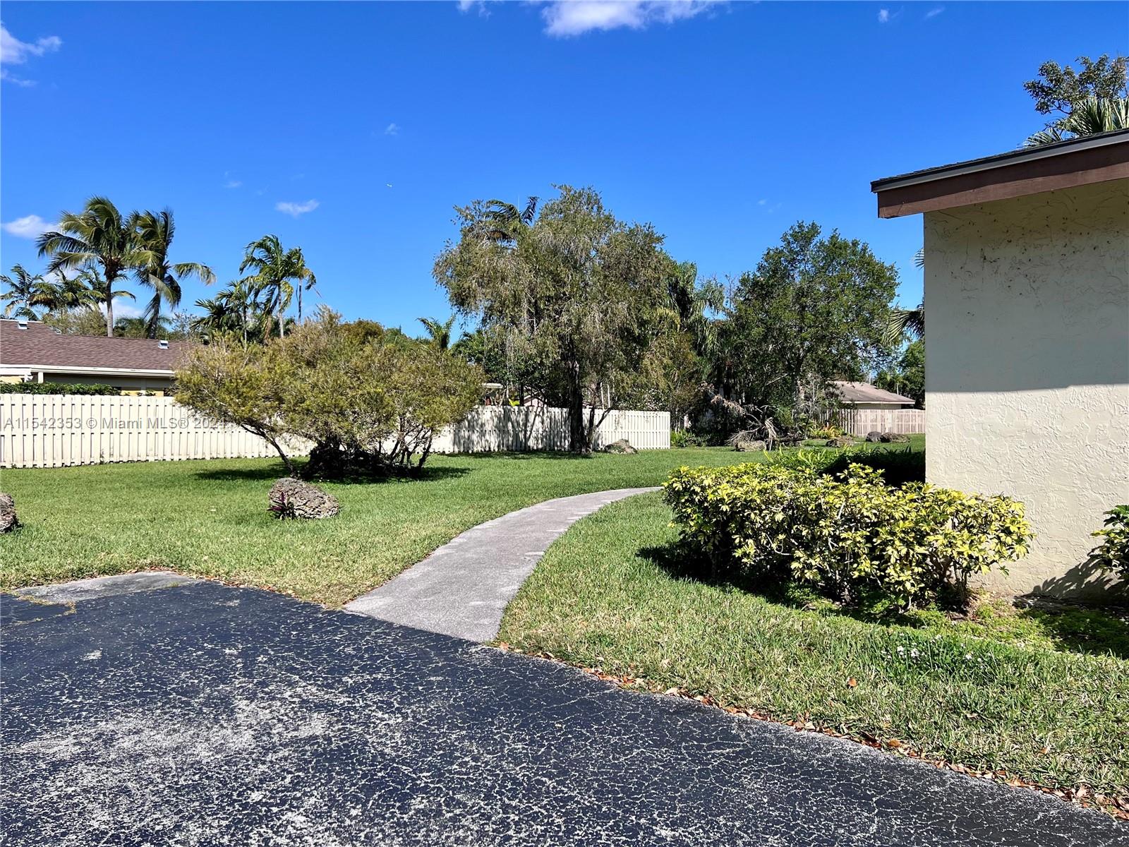 11353 Southwest 109th Road, Unit 55Z Miami, FL 33176 - Photo 54 of 82 a view of a house with a yard