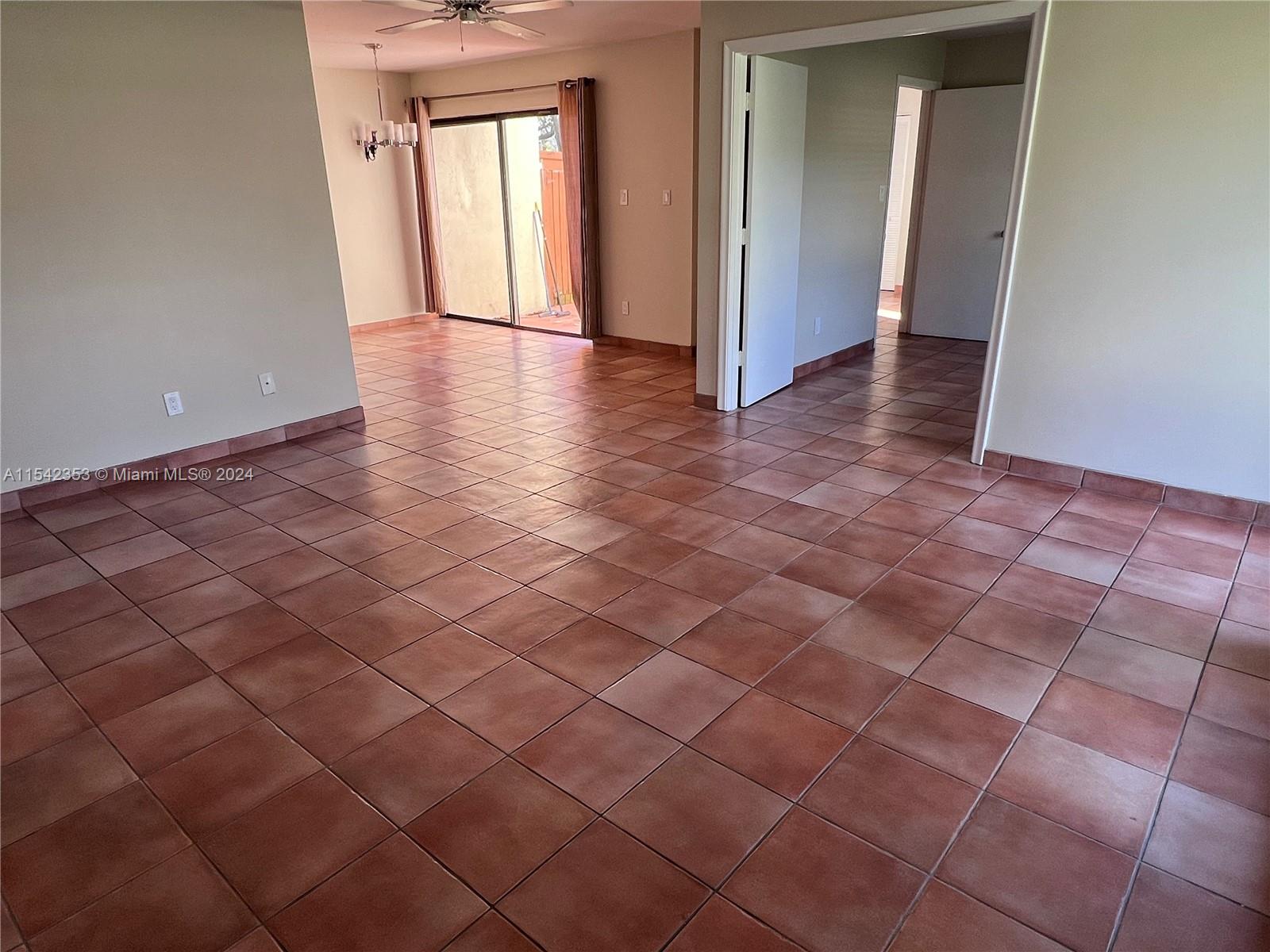 11353 Southwest 109th Road, Unit 55Z Miami, FL 33176 - Photo 6 of 82 an empty room with a white door and a window