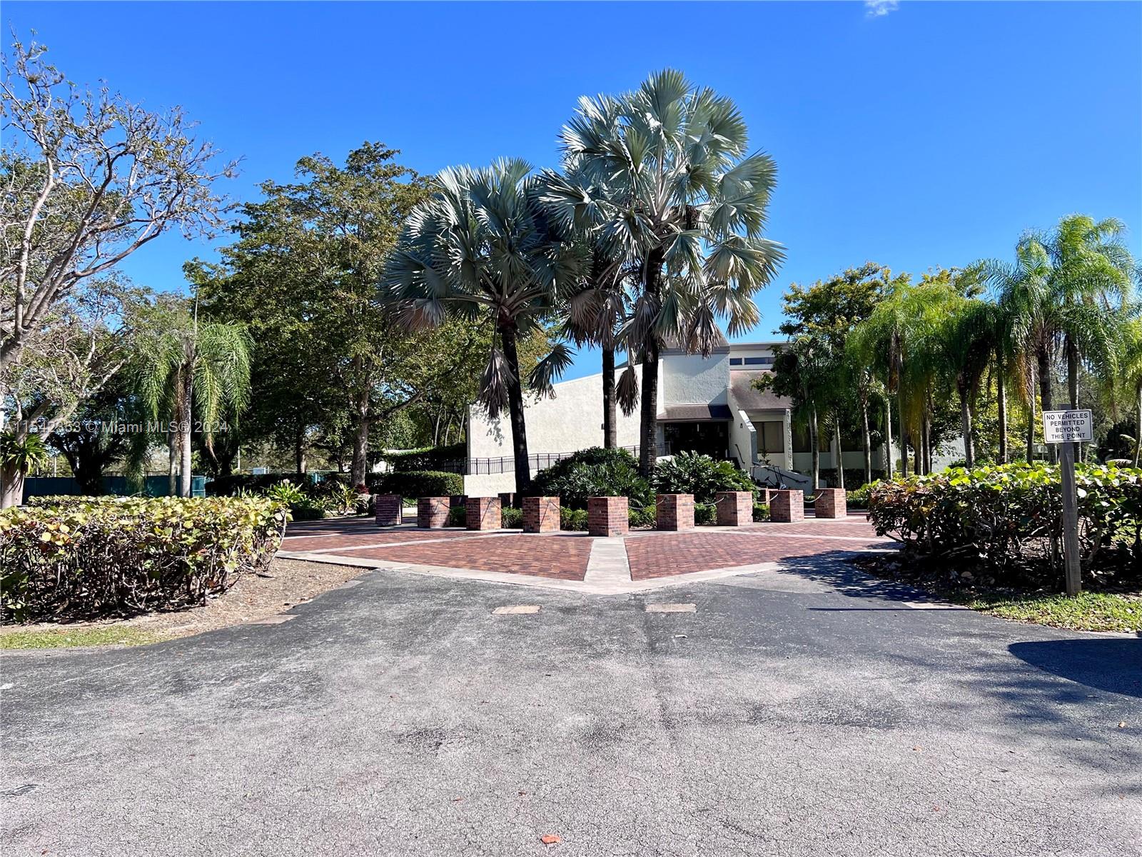 11353 Southwest 109th Road, Unit 55Z Miami, FL 33176 - Photo 63 of 82 a view of a street with a building in the background