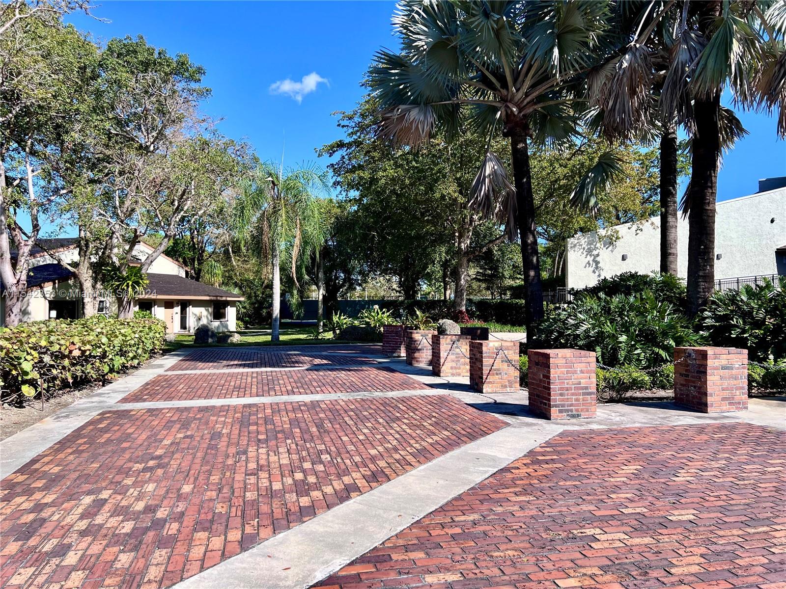 11353 Southwest 109th Road, Unit 55Z Miami, FL 33176 - Photo 64 of 82 a view of a yard with plants and trees