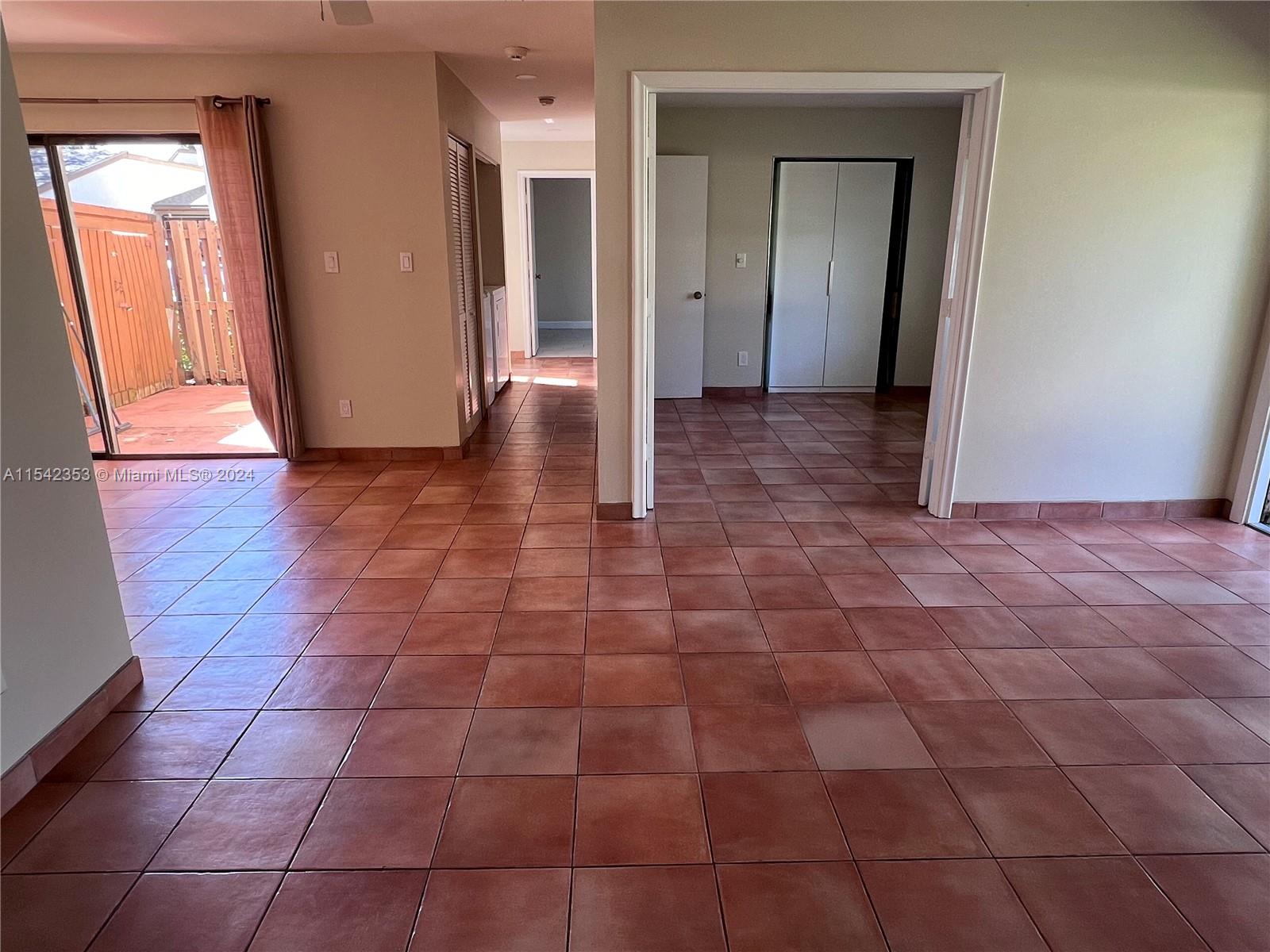 11353 Southwest 109th Road, Unit 55Z Miami, FL 33176 - Photo 7 of 82 a view of a hallway with wooden floor and a bathroom