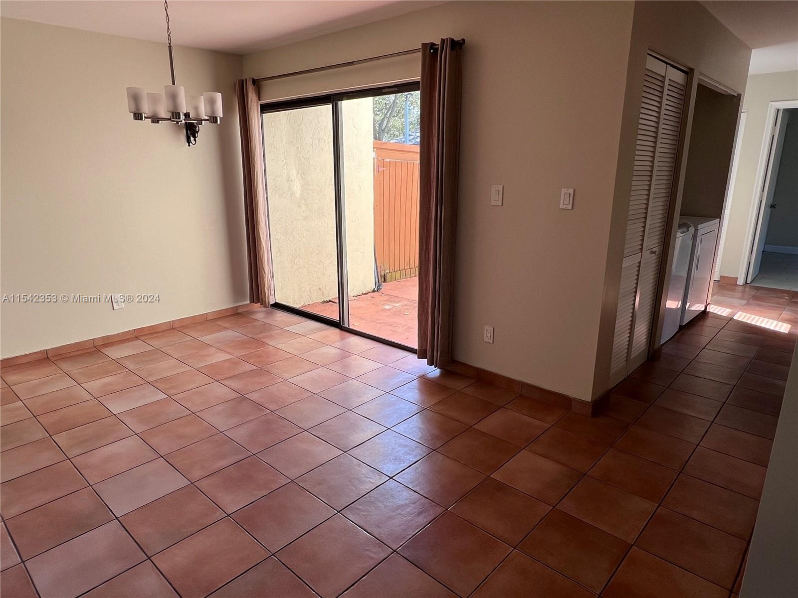 11353 Southwest 109th Road, Unit 55Z Miami, FL 33176 - Photo 9 of 82 a view of an empty room and a window