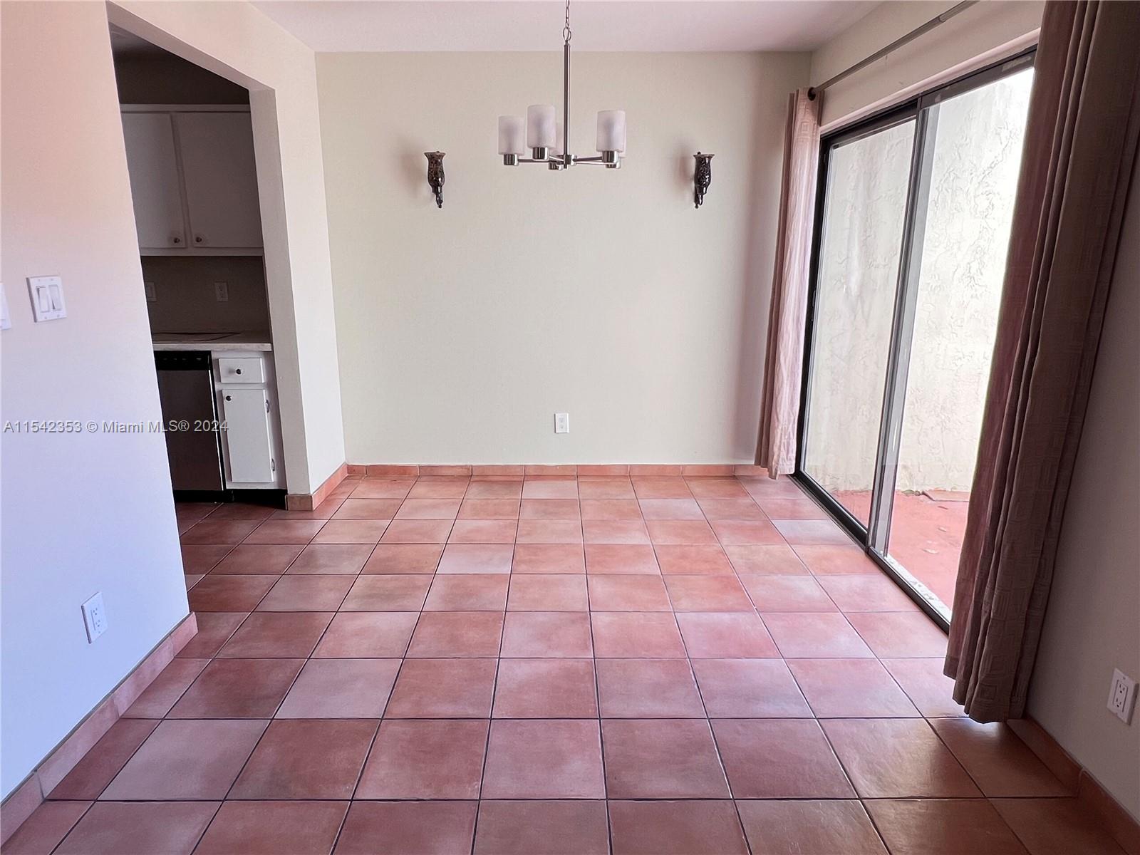 11353 Southwest 109th Road, Unit 55Z Miami, FL 33176 - Photo 10 of 82 a view of an empty room and a window