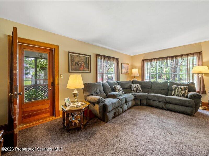 71 Pleasant Avenue Thompson, PA 18465 - Photo 5 of 37 a living room with furniture and a window