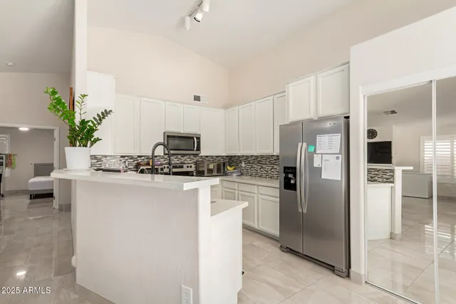 a kitchen with a sink stove and microwave
