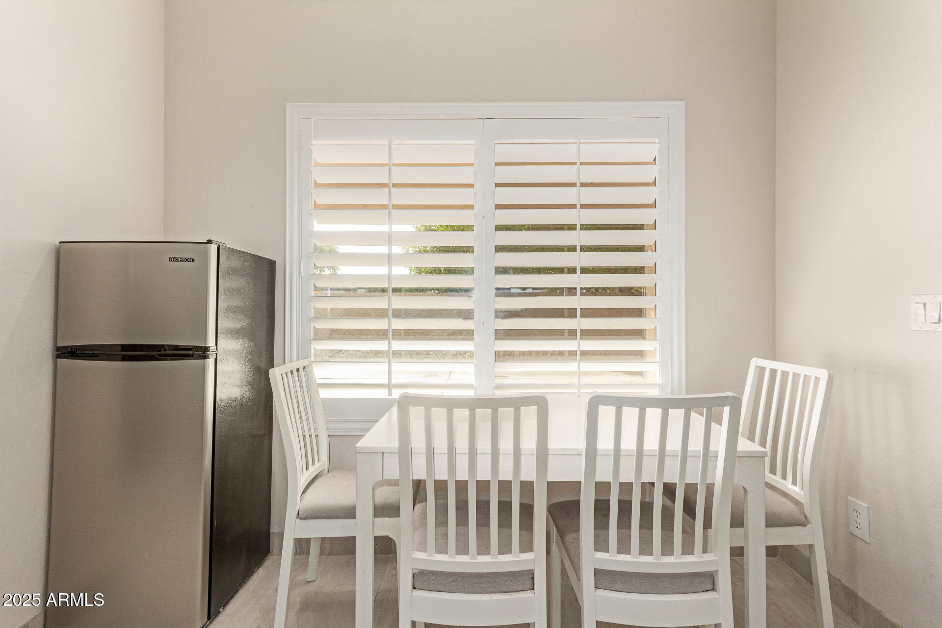 1448 North Saddle Street Gilbert, AZ 85233 - Photo 19 of 34 a view of a bedroom with a window and refrigerator