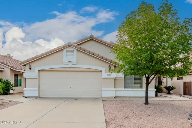 a front view of a house with a garage