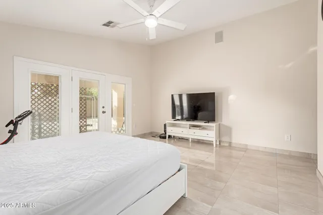 a spacious bathroom with a double vanity sink a mirror and a bathtub