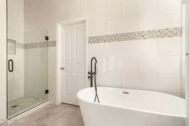 a bedroom with a bed and a desk