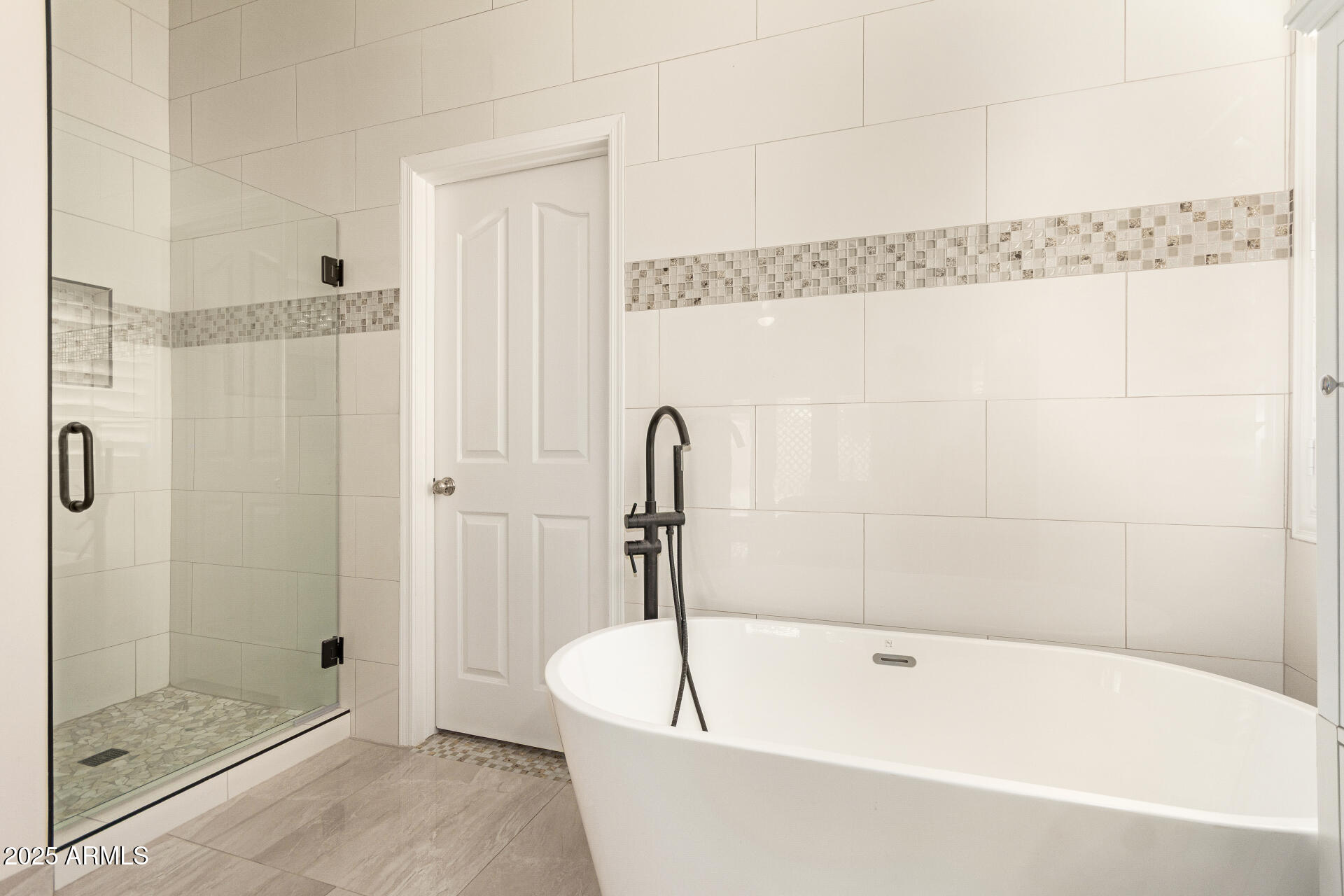 1448 North Saddle Street Gilbert, AZ 85233 - Photo 24 of 34 a bathroom with a white bath tub and shower