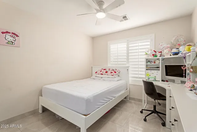 a en suite bathroom with a sink and a mirror