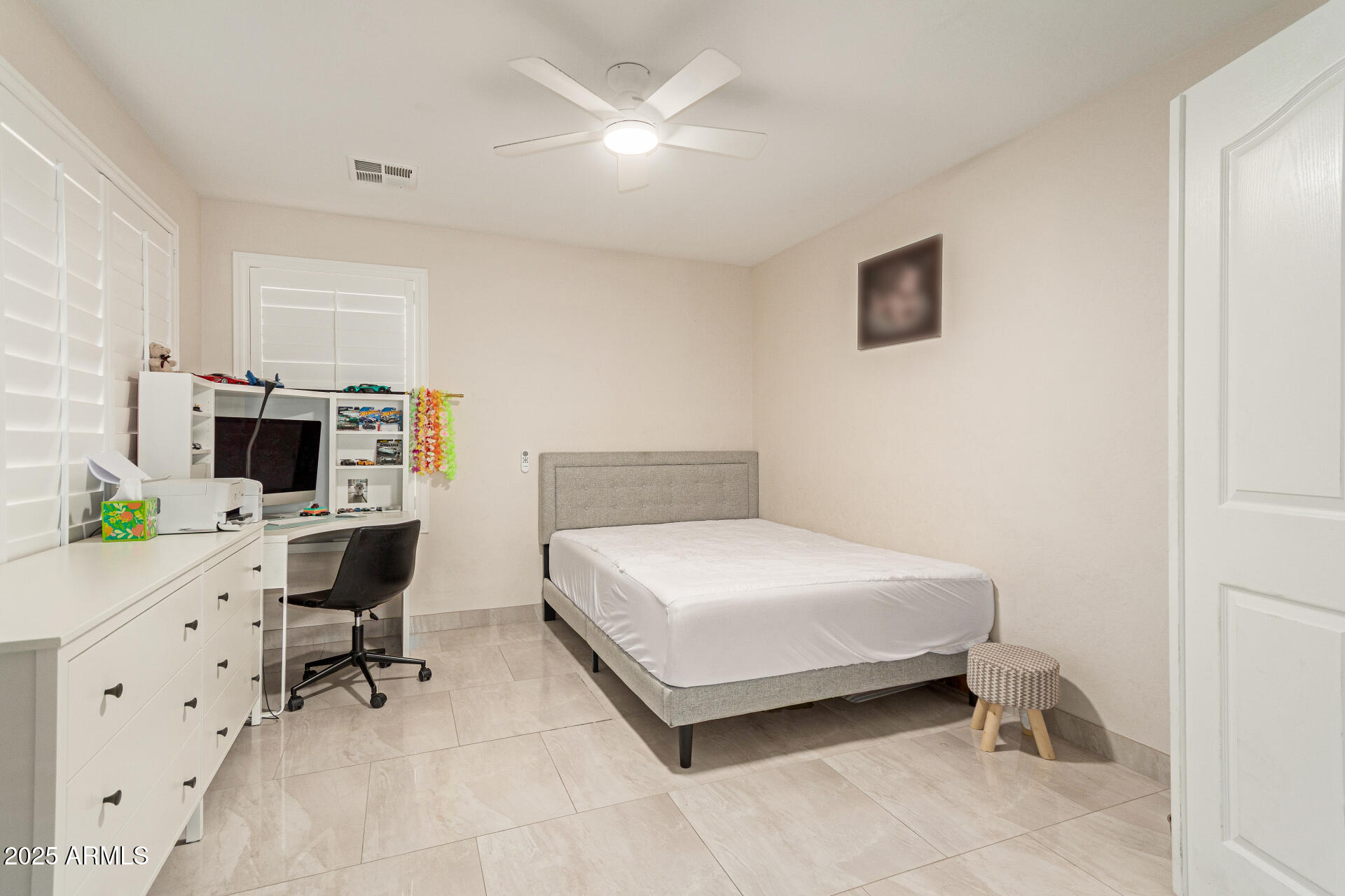 1448 North Saddle Street Gilbert, AZ 85233 - Photo 27 of 34 a bedroom with a bed and a desk