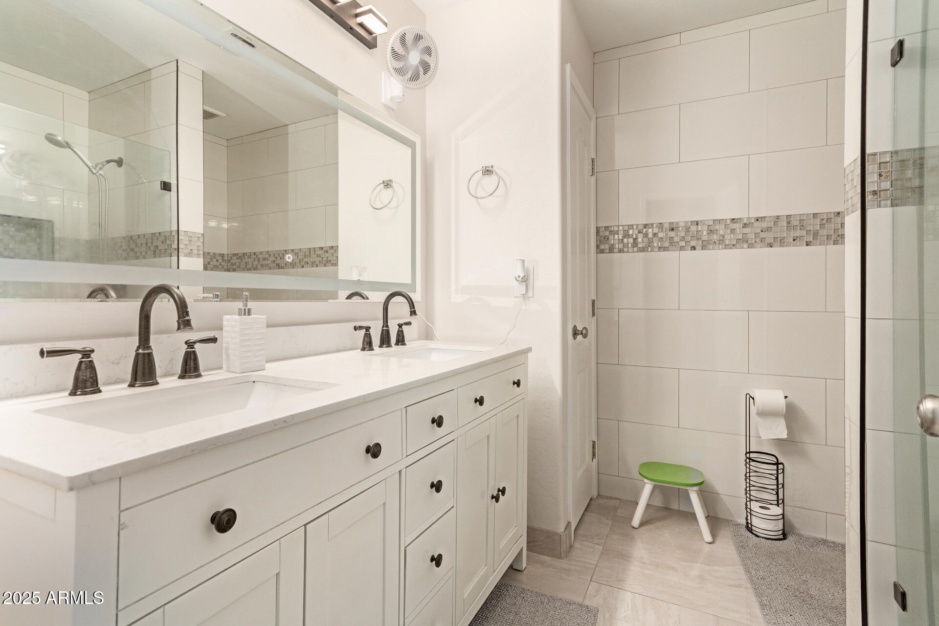 1448 North Saddle Street Gilbert, AZ 85233 - Photo 29 of 34 a bathroom with a double vanity sink a mirror and a