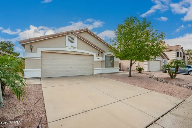 a front view of a house with a garage