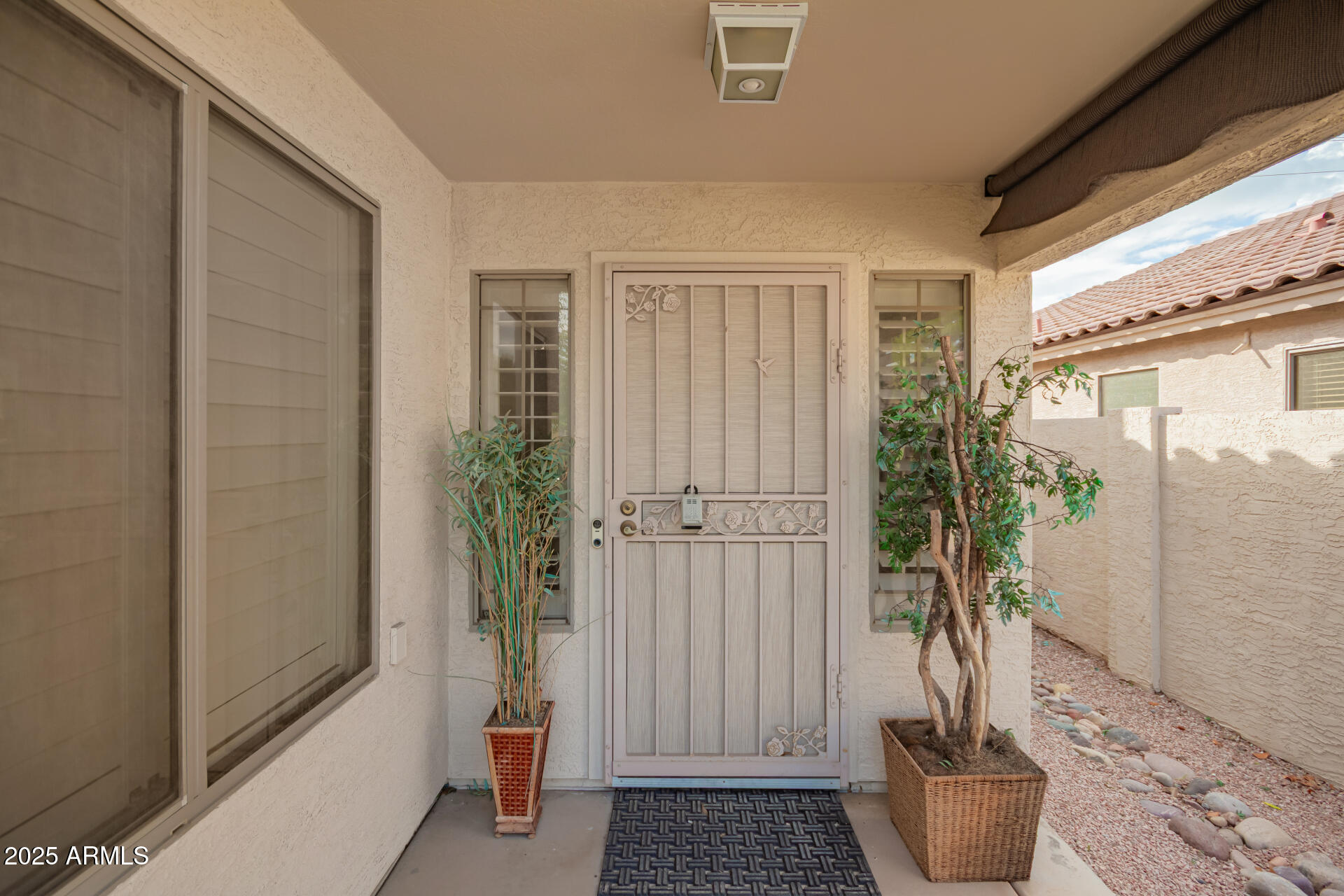 1448 North Saddle Street Gilbert, AZ 85233 - Photo 7 of 34 a living room with furniture and a potted plant
