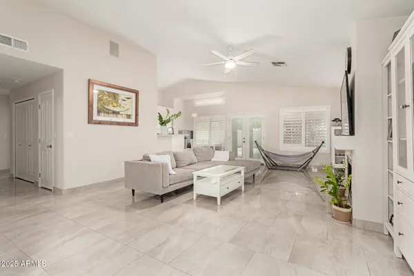 a living room with furniture and a large window