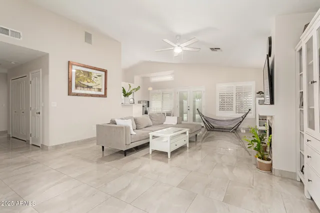 a living room with furniture and a large window