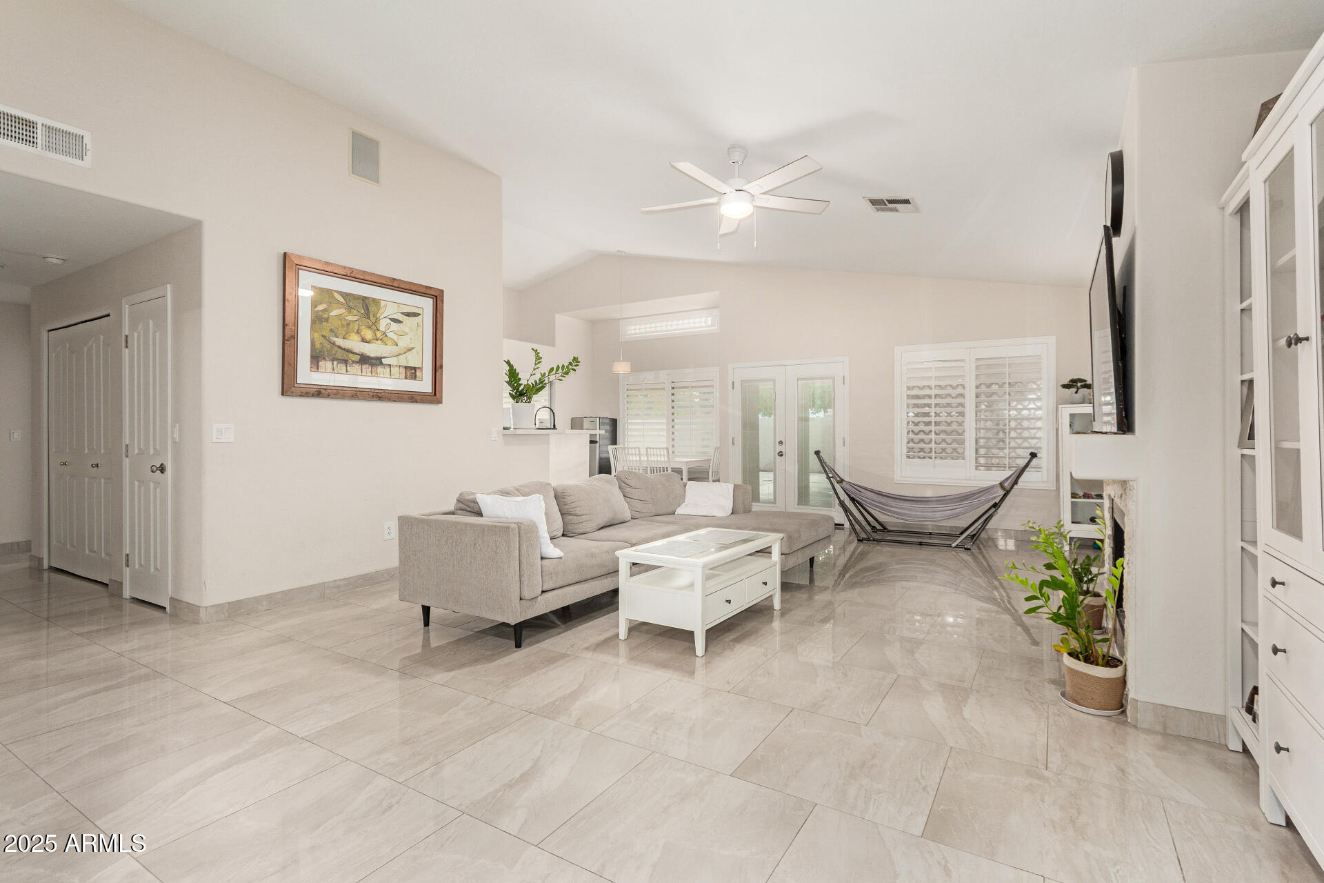1448 North Saddle Street Gilbert, AZ 85233 - Photo 9 of 34 a living room with furniture and a large window
