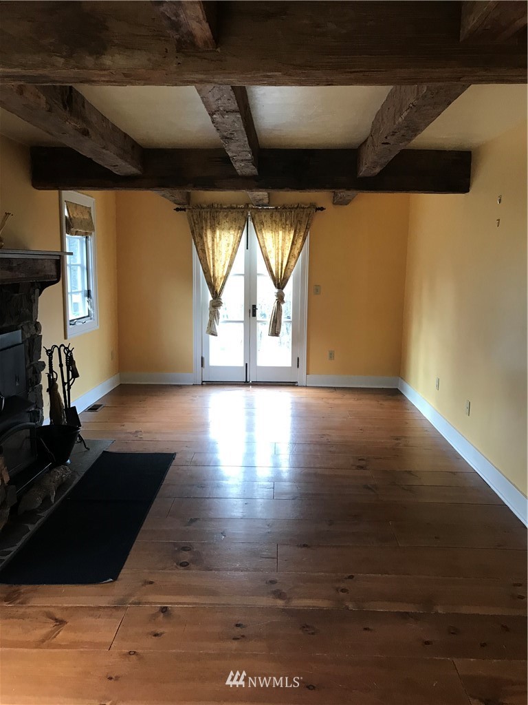 1569 North Fork Road Chehalis, WA 98532 - Photo 12 of 20 a view of empty room with wooden floor and fan