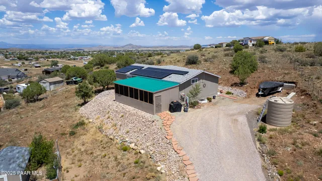 a view of a terrace with a garden and covered with snow