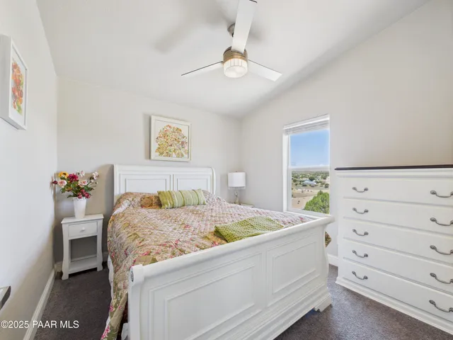 a bed room with a bed and a dresser