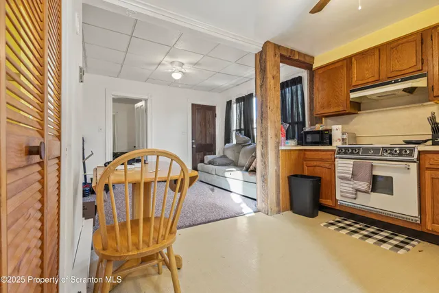 a view of a livingroom with furniture and a fireplace