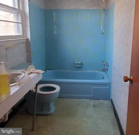 a bathroom with a sink and a bathtub