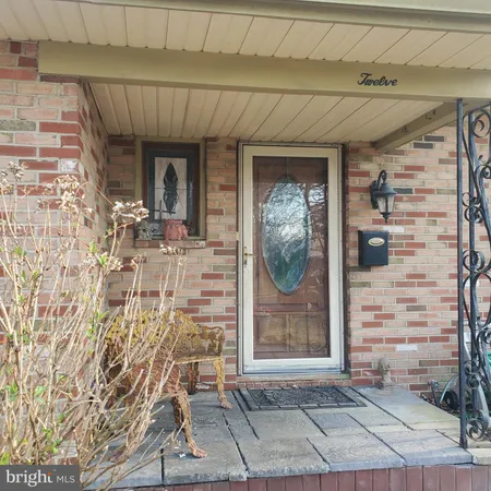 a front view of a house with a glass door