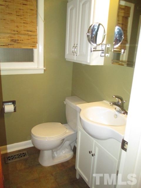 704 Cooper Road Raleigh, NC 27610 - Photo 15 of 25 a bathroom with a sink and a toilet