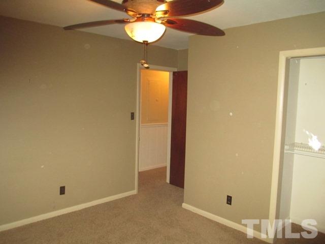 704 Cooper Road Raleigh, NC 27610 - Photo 19 of 25 a view of a room with a chandelier fan