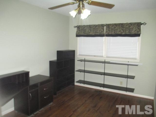 704 Cooper Road Raleigh, NC 27610 - Photo 20 of 25 a view of a cabinet with wooden floor
