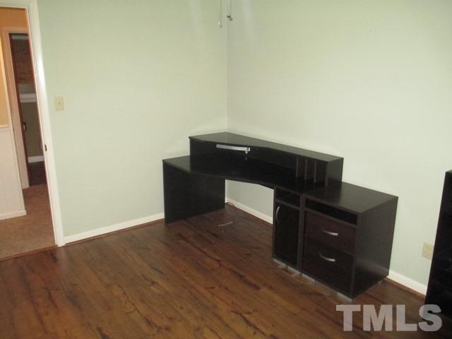 704 Cooper Road Raleigh, NC 27610 - Photo 21 of 25 a living room with wooden floor