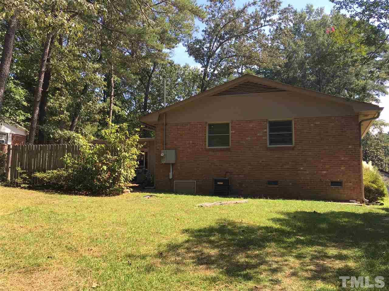704 Cooper Road Raleigh, NC 27610 - Photo 24 of 25 a front view of a house with a yard