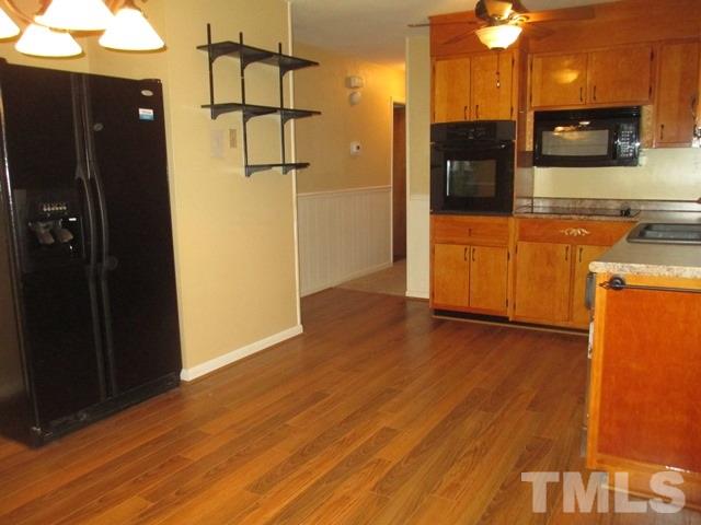 704 Cooper Road Raleigh, NC 27610 - Photo 10 of 25 a view of a kitchen from the hallway
