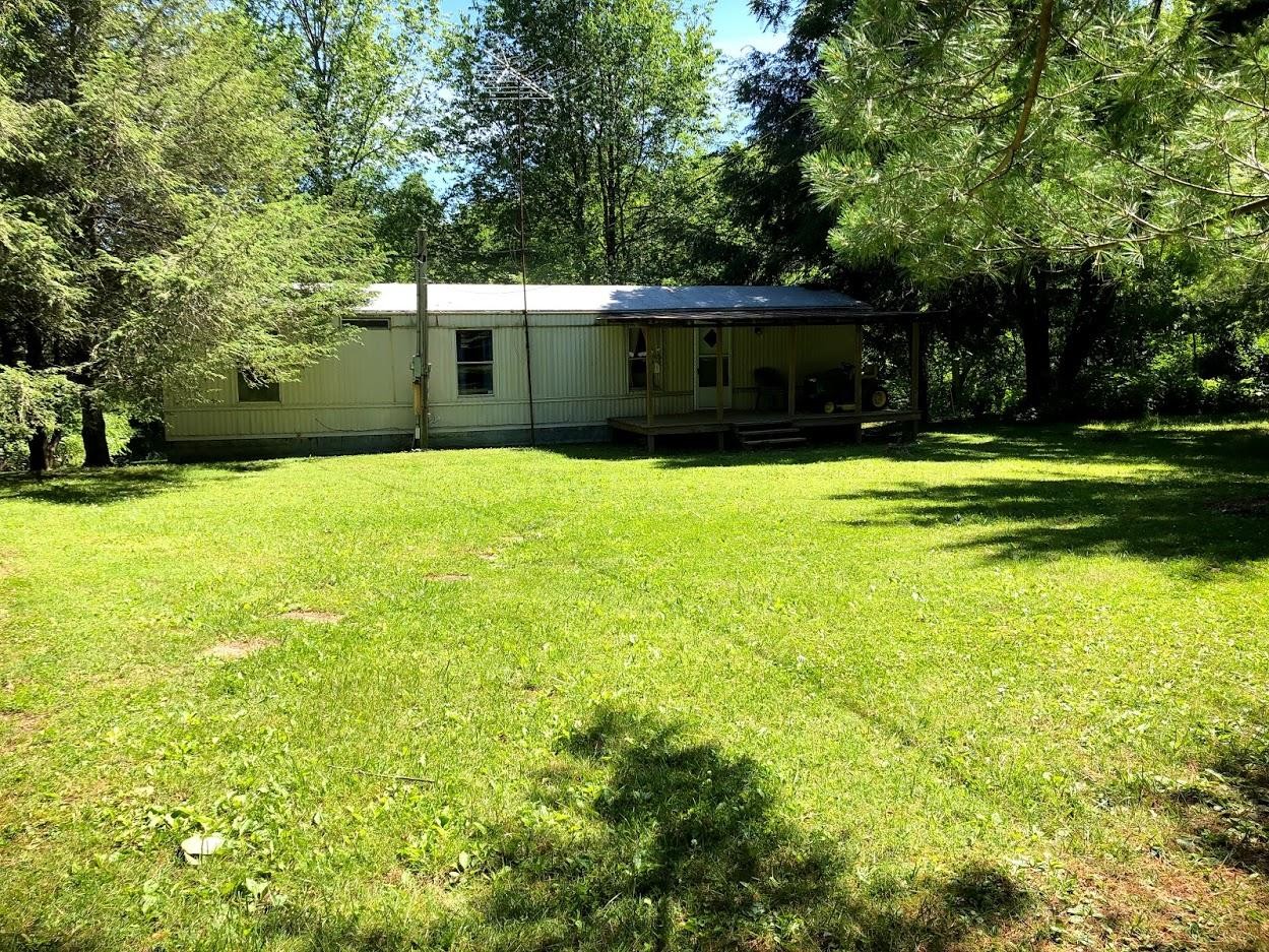 102 Speed Road Jamestown, TN 38556 - Photo 1 of 7 a front view of a house with a yard