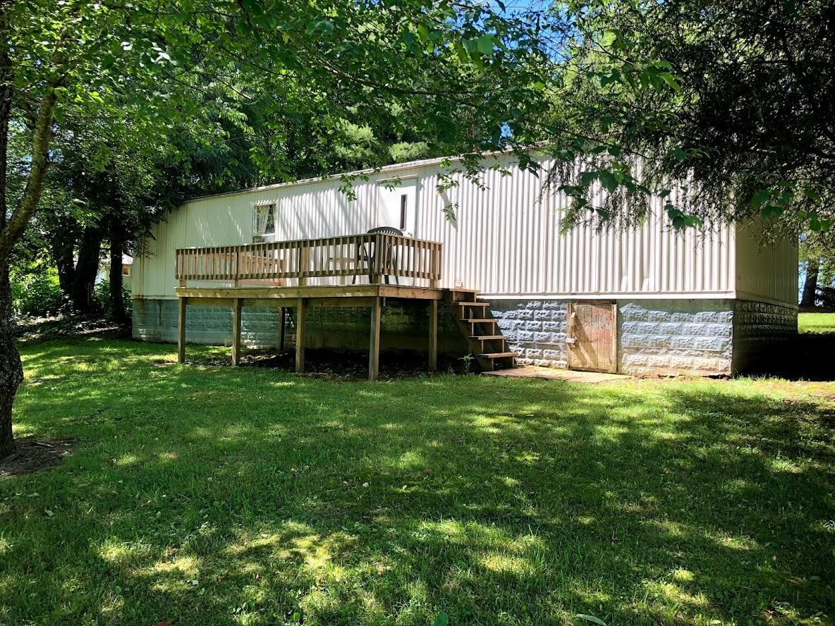 102 Speed Road Jamestown, TN 38556 - Photo 7 of 7 a view of backyard with small cabin