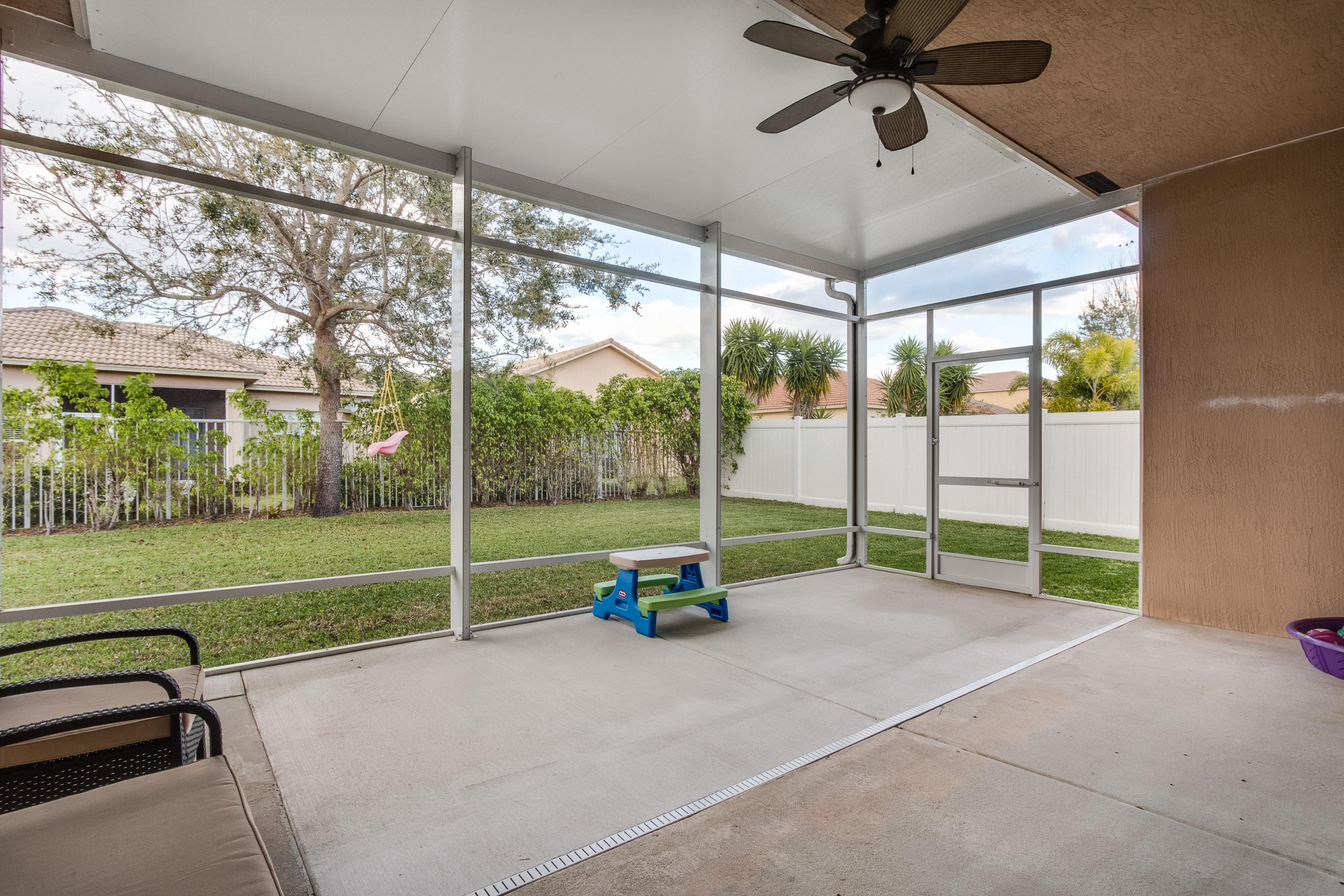 5953 Spanish River Road Fort Pierce, FL 34951 - Photo 20 of 27 Extended Covered, Screened Patio
